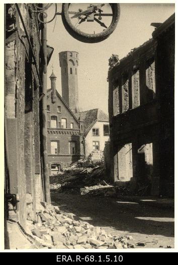 Consequences of March bombing in the Old Town of Tallinn: view of Raekoja with a tower crushed from Harju Street