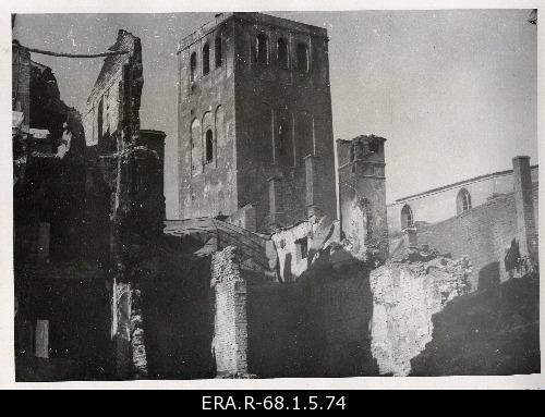 The consequences of the 9th March bombing in Tallinn: the view of the tower of the Niguliste Church between the ruins of Harju Street