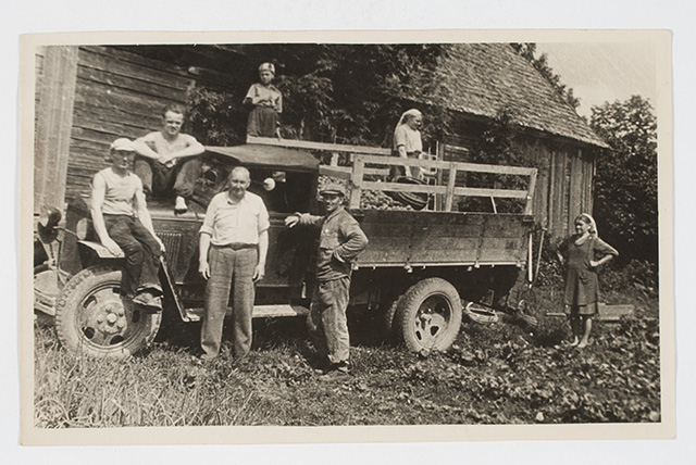 Truck with potato load and agricultural workers