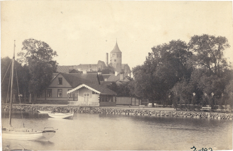 Photo. View of the Great Promenade from Haapsalu Back Chain. At the forefront of the sailing and two boats, reading houses. In the back of the bishop