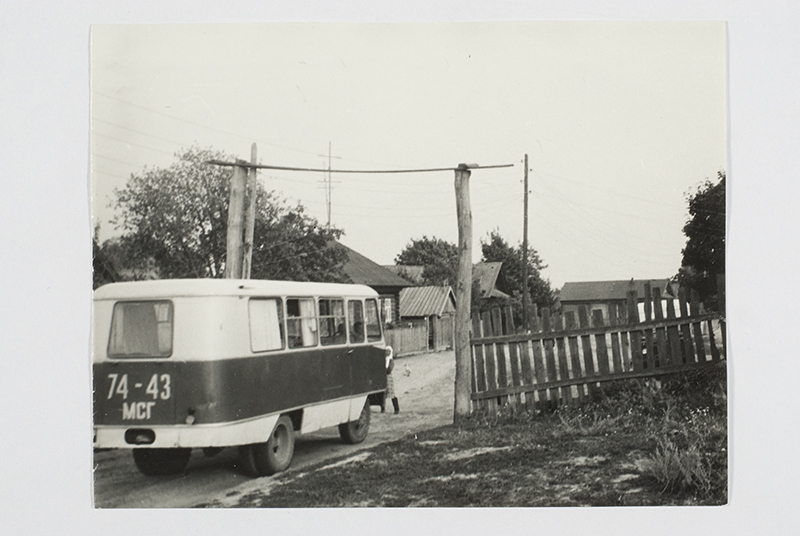 Visiting, the expedition bus enters the village.