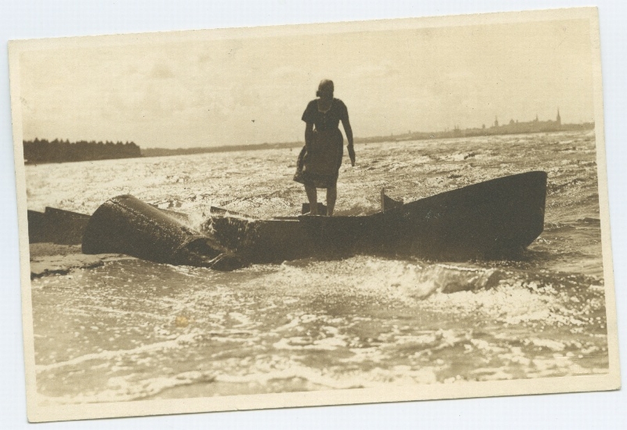 Tallinn, Pirita, the sea, a boat and a woman standing there.