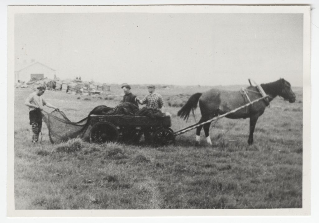 Wooden fishermen charging nets on the van