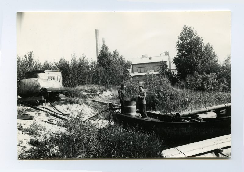 Mechanized Water Construction Colonel Development Master Treil with a companion on the shore of Lake Ülemiste to take fuel for soil pump