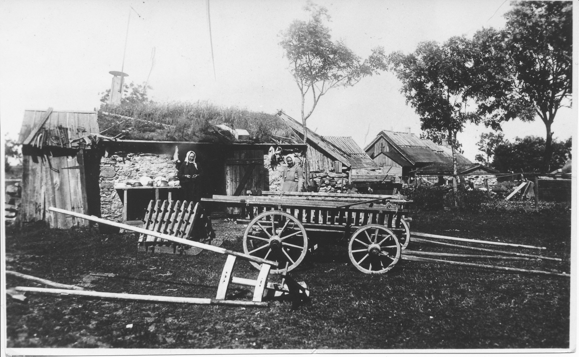 Vehicles and tools at the yard of the farm in Osmussaari