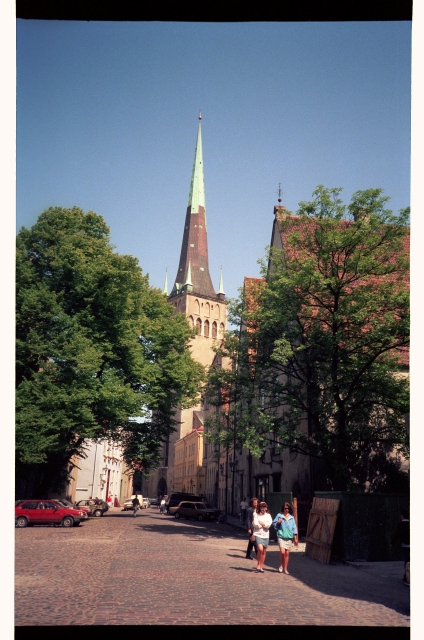 View of the Oleviste Church from wide street in Tallinn