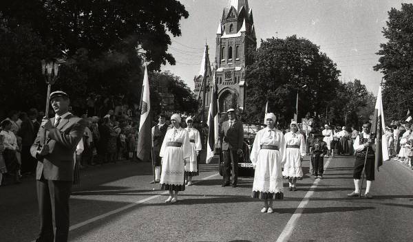 Photo-negative. Tartu Song Festival 1990 train run at the Tartu Peetri Church.