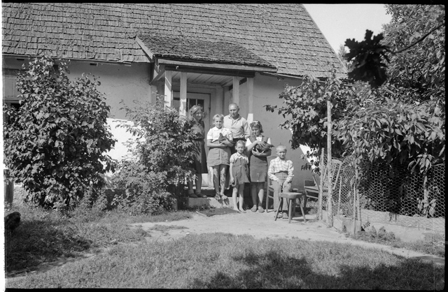 Family in front of the house
