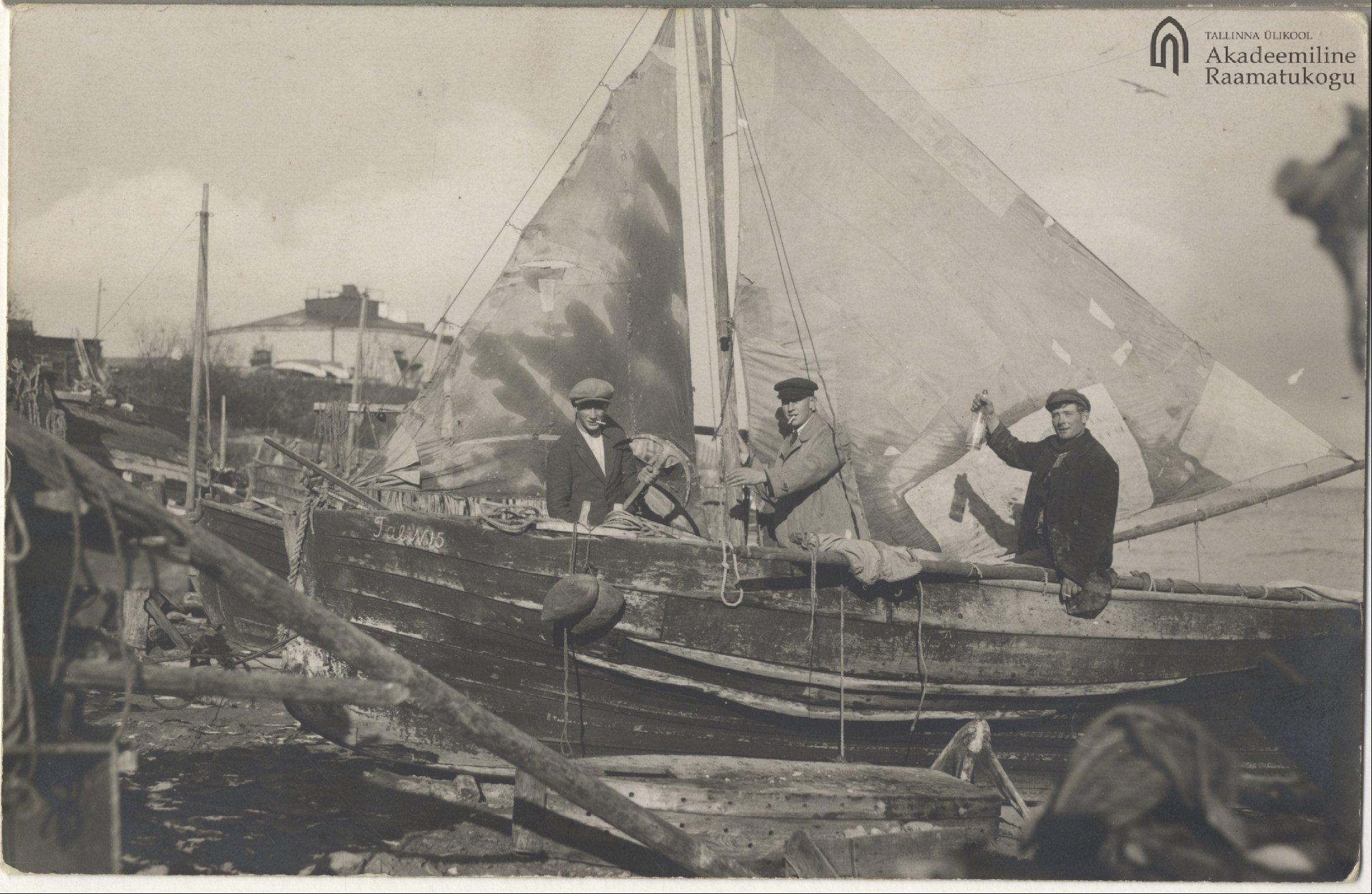 Tallinn. Three fishermen with their sailing boat