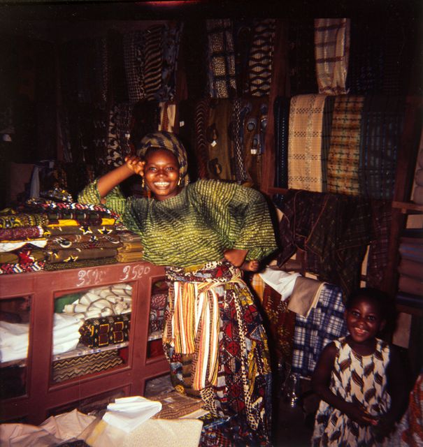 Young Nagô mother in her fabric store; interior picture
