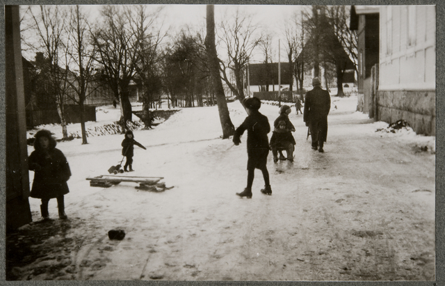 Children play on the ice beach at the church