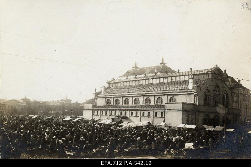 View of traders on the market building at the square.