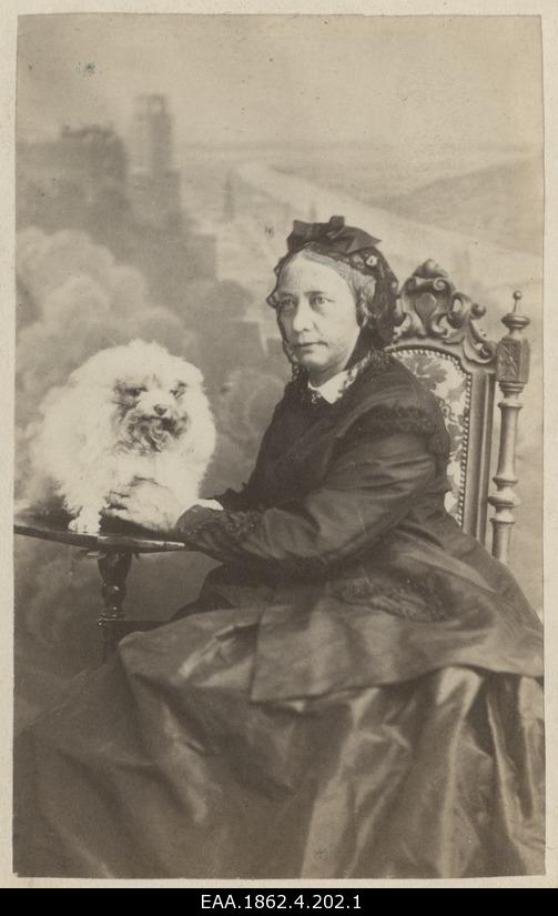 A portrait of older lady with a dog
