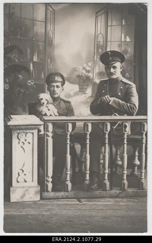 Two unidentified [Russian army] soldiers on the photo portree with a dog