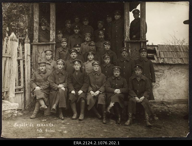 Members of the team of the 5th Battalion Spires group photo at the building stairs
