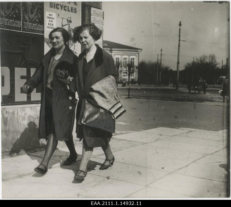 Two women walking on the street