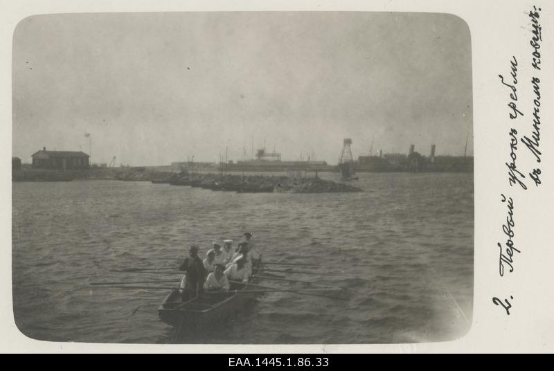 On the front of the boat with the riders, the port at the same time