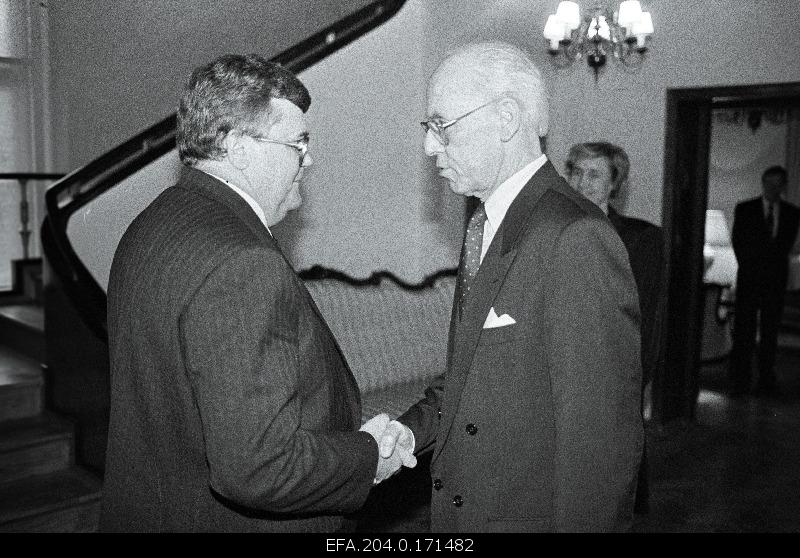 President Lennart Meri (best) congratulates the Deputy Chairman of the Riigikogu, Edgar Savisaart, after re-election to the Head Trinity of the Riigikogu.