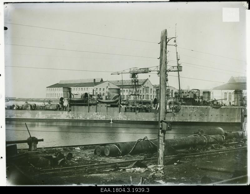 Warship, factory buildings on the shore