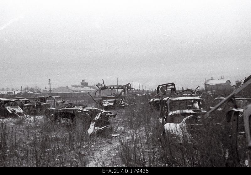The ruins of German cars behind the iron station on the scene.