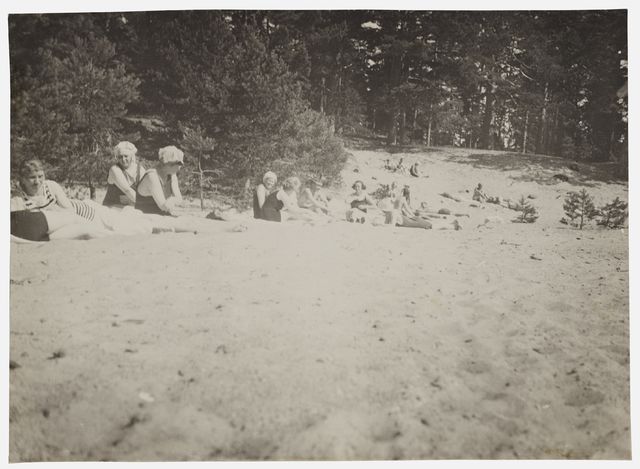 Women on the sandy beach of Suursaaren - capable, black and white, photo area 8 x 11 cm