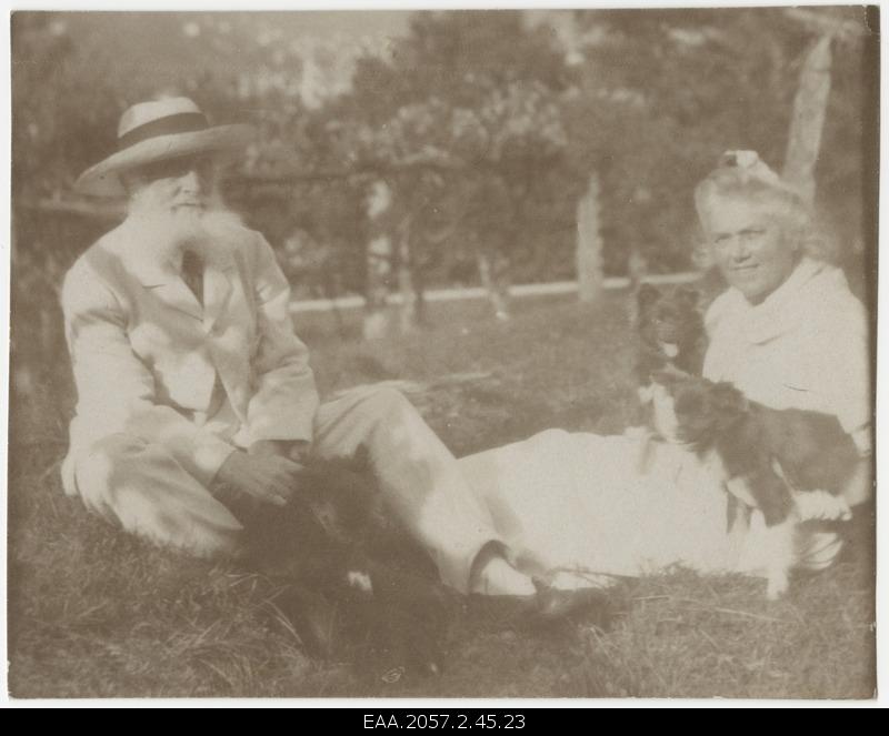 Older man and woman with dogs