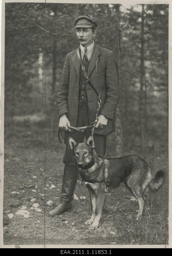 A. Friend, Estonian Police Dog Instructor, his armhole service dog Välk