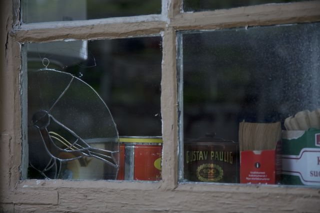 Blue Hope Cafe, window; outdoor picture, coffee bottles pictured through the window