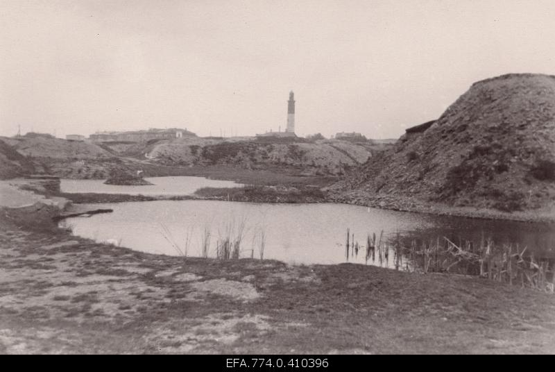 View of the Lasnamäe battery holes towards the Upper Lighthouse (Punane fire tower).