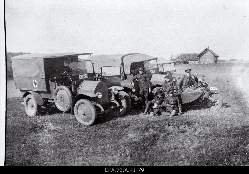 Soldiers at trucks.