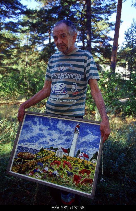 Kihnu artist Endel Tehvand with his painting.