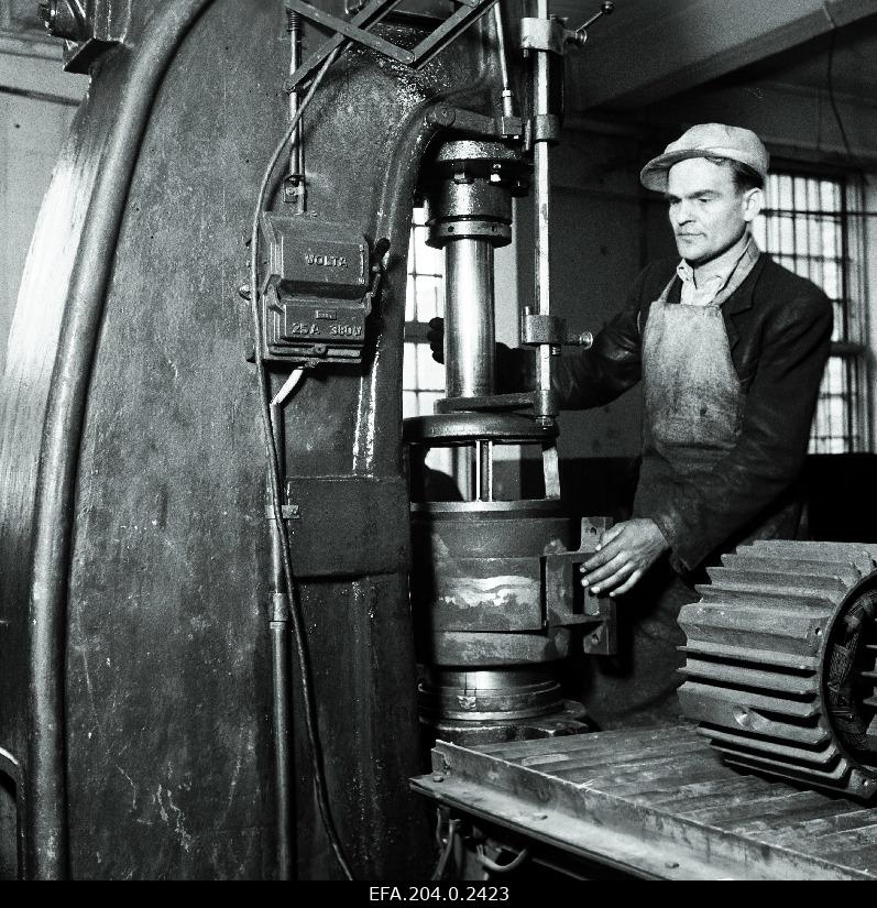 Factory Volta front presser Klesment at his work.