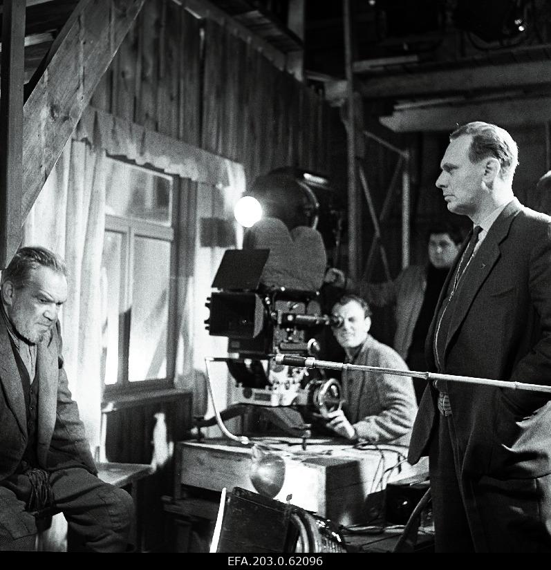 The director of the film studio "Tallinnfilm" G.Kromanov (righter), operator H.Rehe and K.Karm Niglase player during the film "The men of one village".