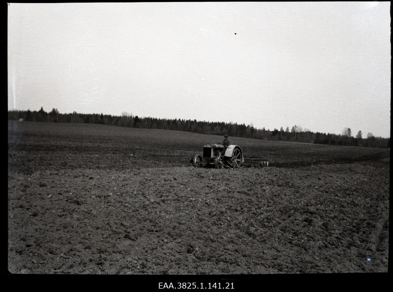 Man doing agricultural work with tractors