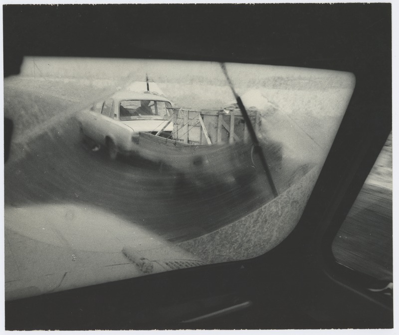 View through the window of the car: a passenger car with a follow-up.