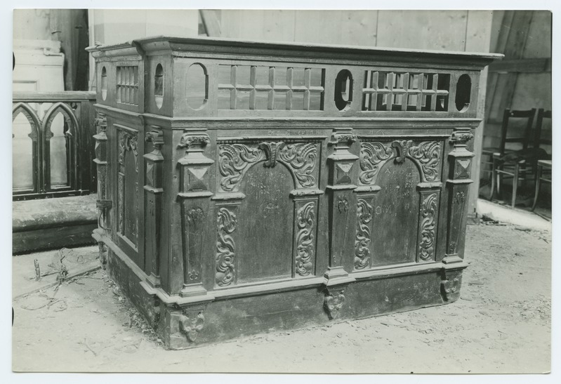 Closed church bench, decorated with wooden beds, in the Niguliste Church.