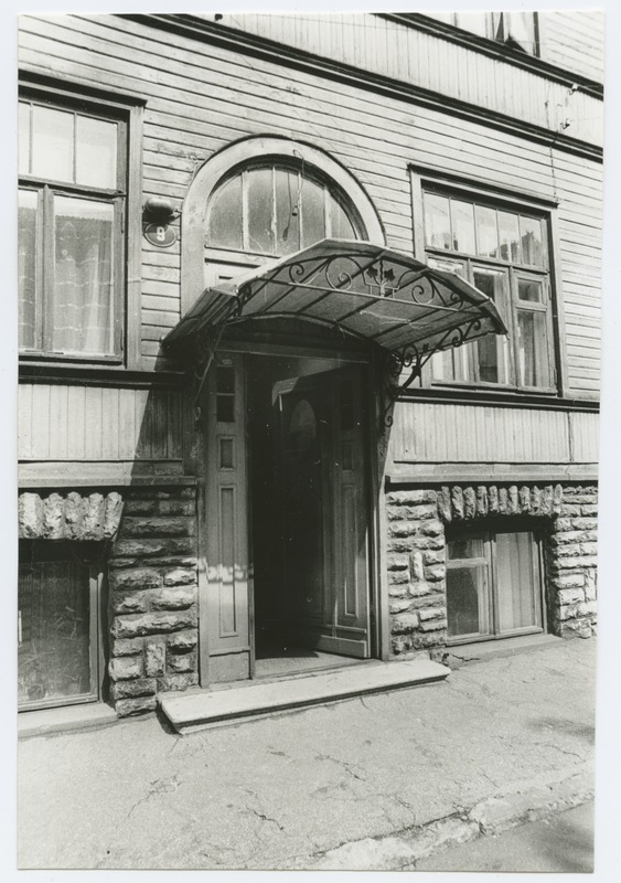 Peeter Süda Street 9 wooden building external door and shadowing.