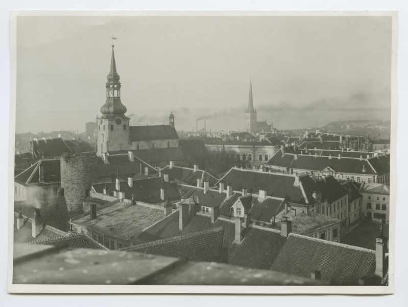 View on the roofs of Toompea buildings and the Toom Church, in the background of the Oleviste Church.
