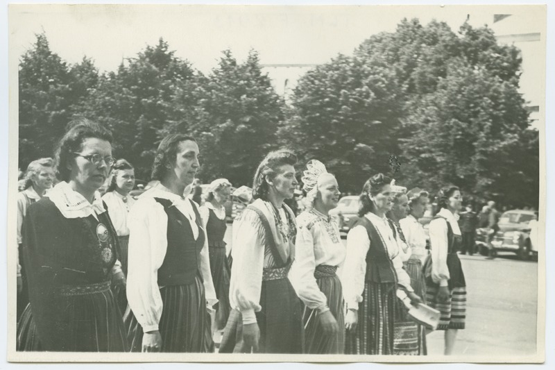 The 1950s song festival in Tallinn, the folk clothes of women singers on the train.