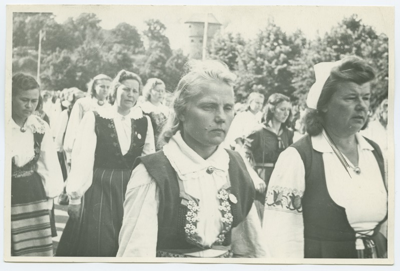 The 1950s song festival in Tallinn, the folk dressed women singers on the train.