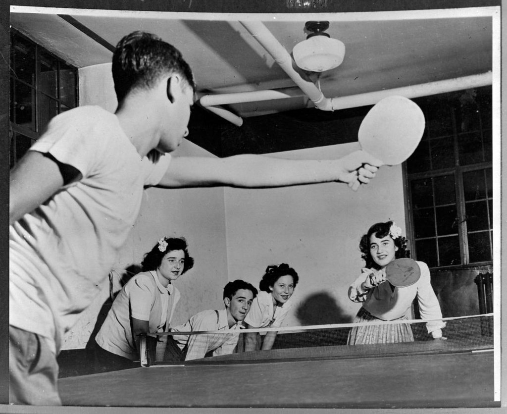 Boy and girl play ping-pong, about 1950
