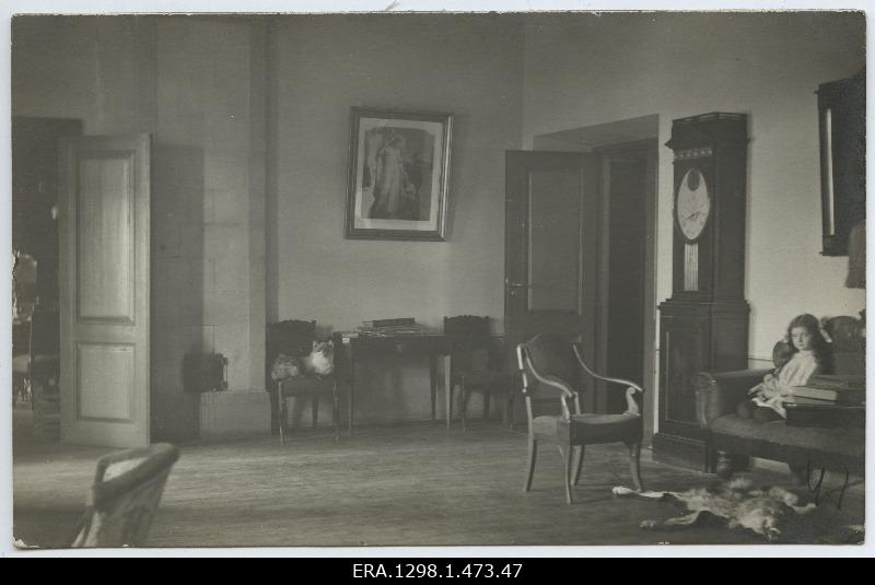 Unknown girl sitting on a sofa in the Service Manor, on a chair in a rebasetop