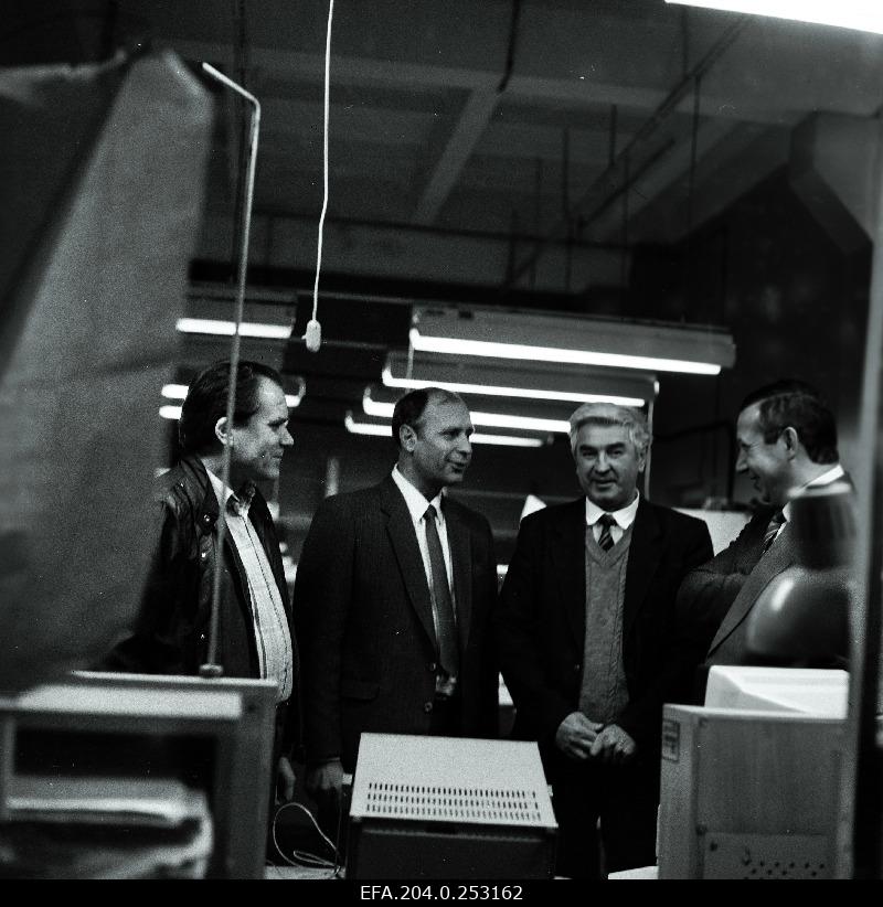 Valeri Tšetvergov, Director General of the Baltijets production unit (from left 2) The production of the factory with the co-workers - at the school personal computers at Juku.