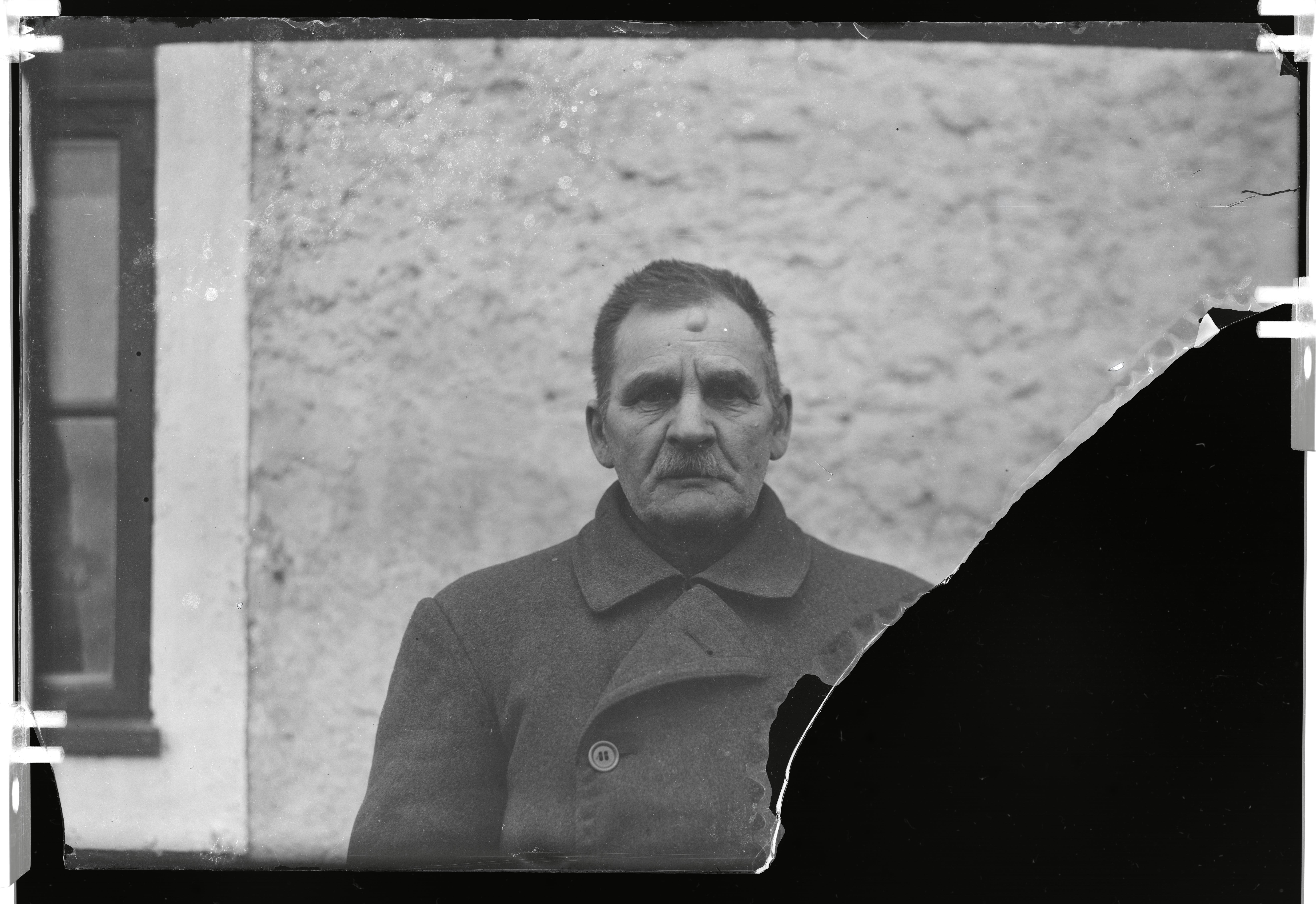 Kunda factory. A man in the wall background.