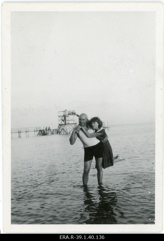 Johannes Vares stood in the water on the beach of Pärnu, Emilie Vares' husband on the back
