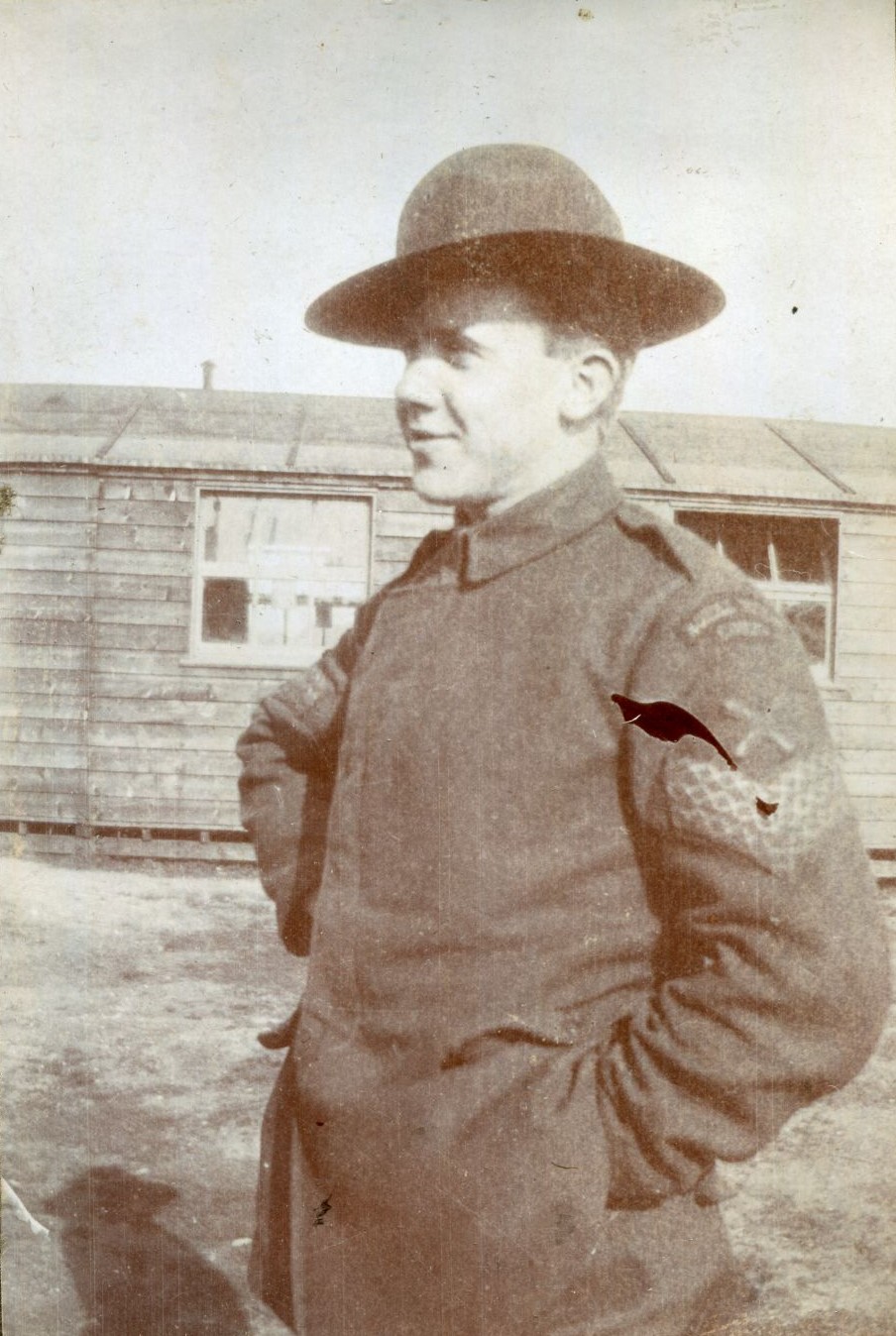 Arthur George Simmons in front of hut at Beaulieu Aerodrome, 1918