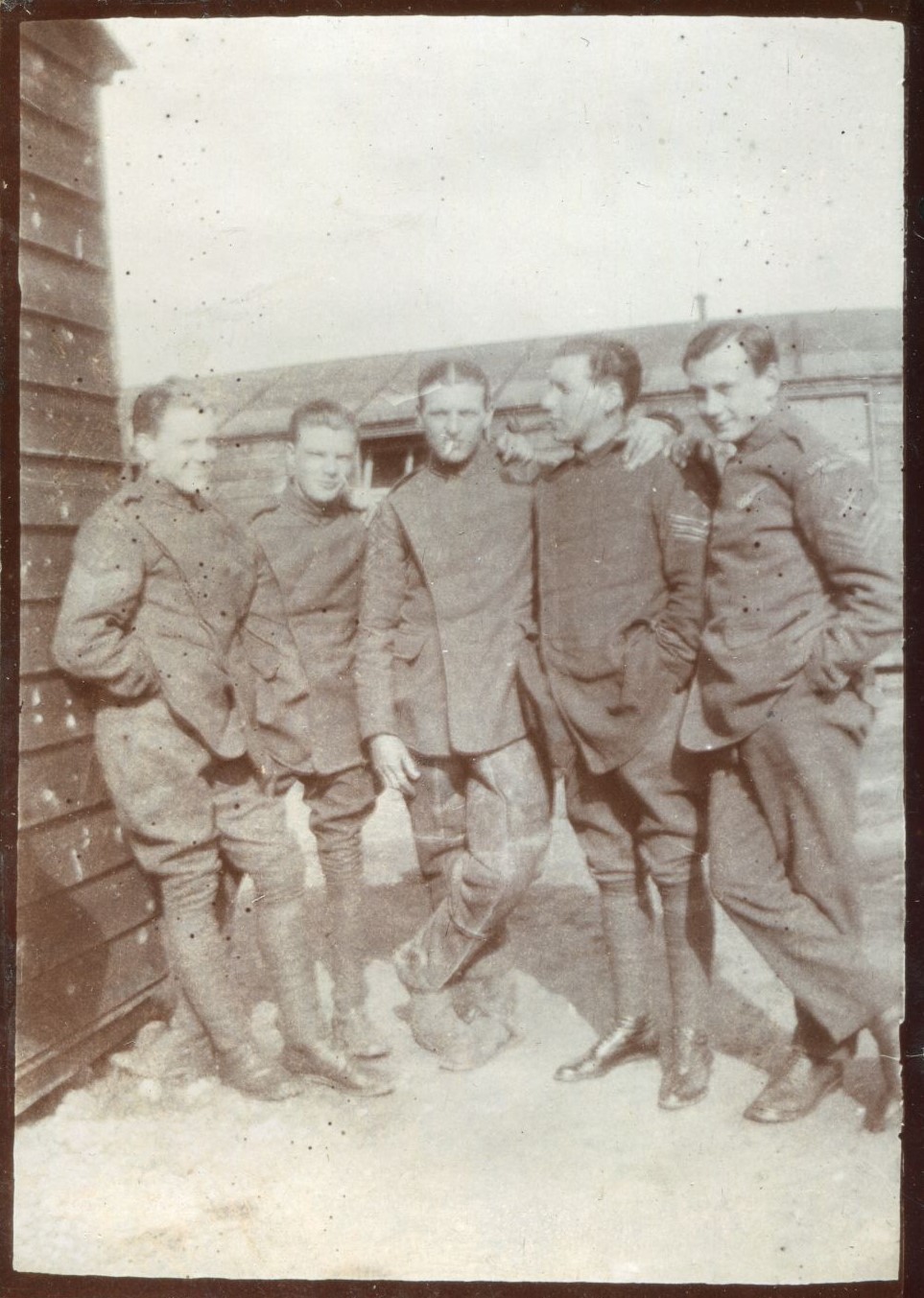 Five men leaning with hands on each others shoulders, at Beaulieu Aerodrome, 1918
