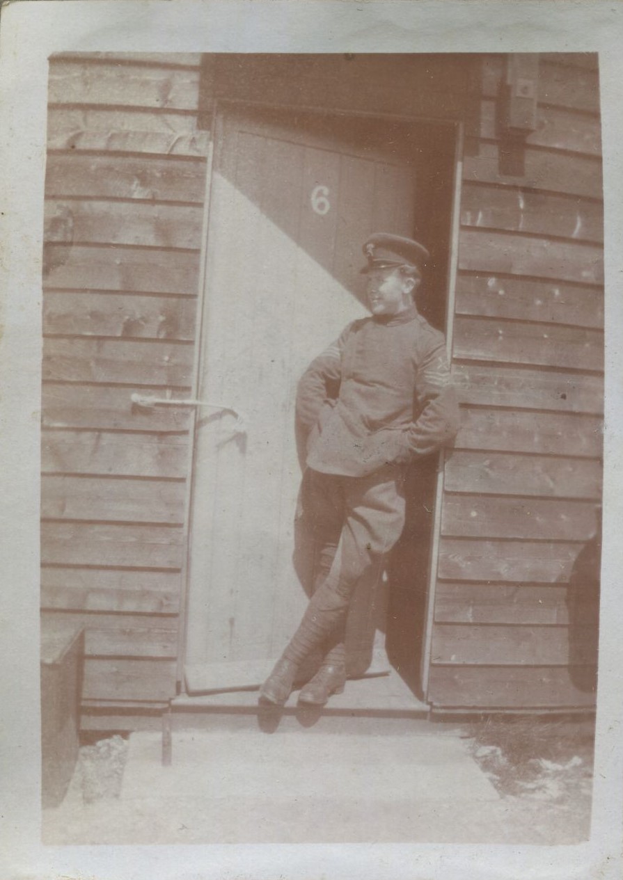Man in uniform leaning against the door of hut 6, Beaulieu Aerodrome, 1918