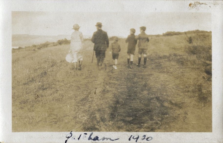 Family group walking away down a path, Patcham 1920