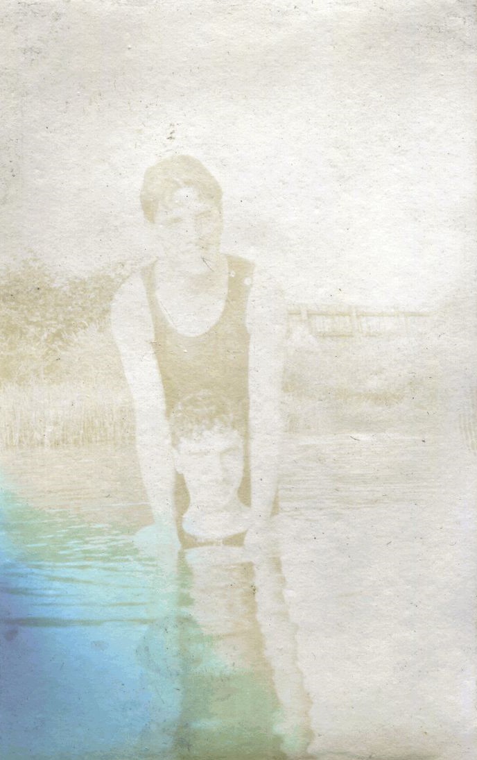 Two males in a lake, one leaning on the other's shoulders, Farnborough